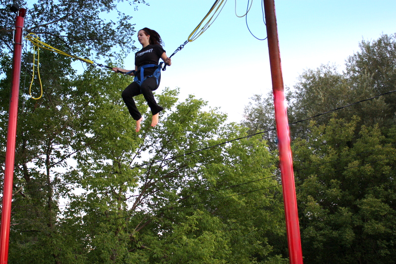 Girl on bungee trampoline